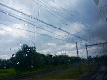 Wet road against sky