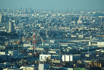 High angle view of buildings in city against sky