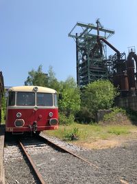 Train on railroad track against sky