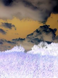 Scenic view of cloudy sky at sunset