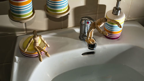 Miniatures on sink in bathroom