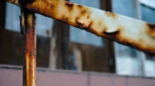 Close-up of rusty metal window