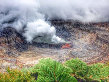 Scenic view of sea against cloudy sky