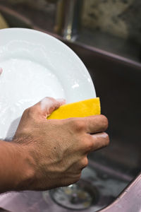 Close-up of hand holding ice cream