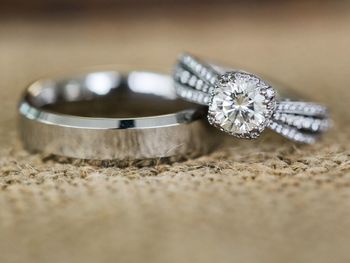 Close-up of wedding rings on table