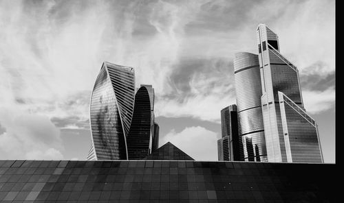 Low angle view of skyscrapers against sky