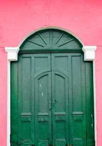 Closed green door of house