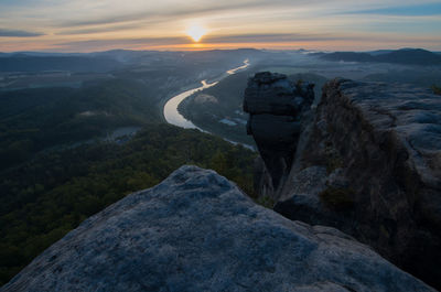 Scenic view of mountains against sky during sunset