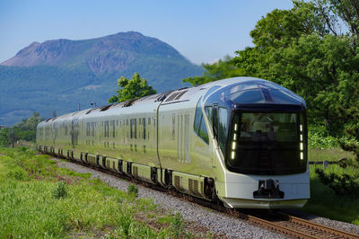 Train on railroad track against sky