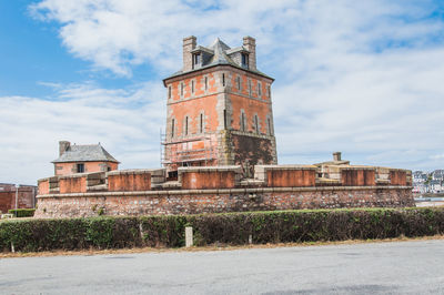 Low angle view of old building against sky