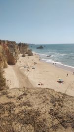 Scenic view of beach against clear sky