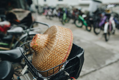 Close-up of straw hat in bicycle basket