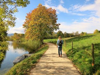 Full length of woman on lake against sky