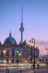 Illuminated buildings against clear sky