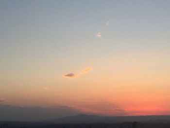 Scenic view of landscape against sky at sunset