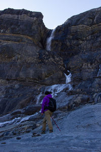 Rear view of man standing on mountain