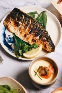 Close-up of fish served on table