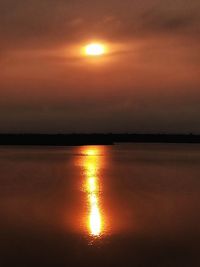 Scenic view of sea against romantic sky at sunset
