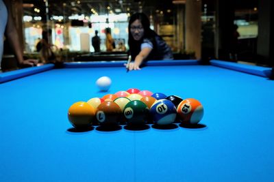 Man playing with ball on table