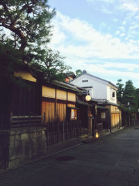 Street amidst buildings against sky