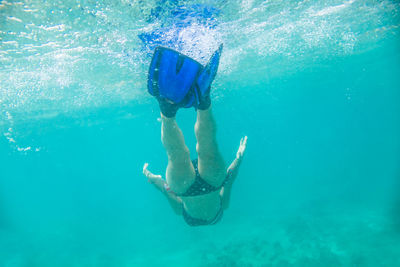 Woman snorkeling in sea