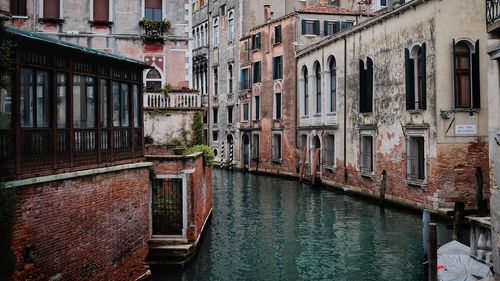 Canal amidst buildings in city