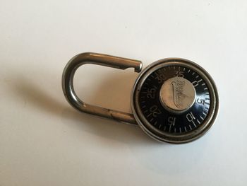 High angle view of coin on table against white background