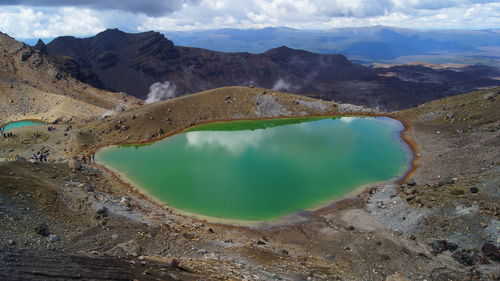 High angle view of lake amidst mountains