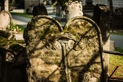 Close-up of angel statue in cemetery