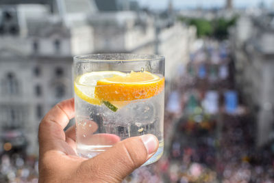 Midsection of person holding drink