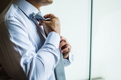 Midsection of man wearing mask