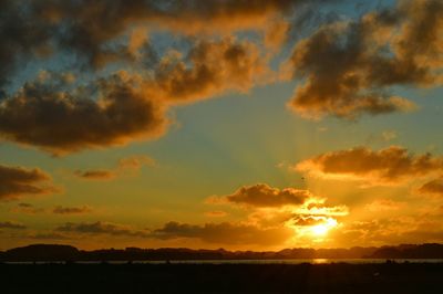 Scenic view of landscape against sky during sunset