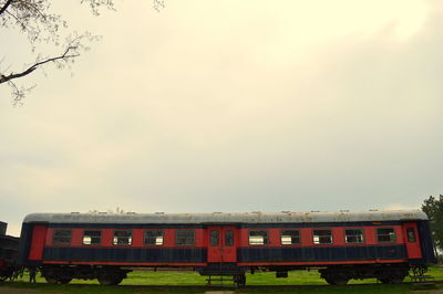 Abandoned train against sky during sunset