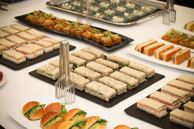 High angle view of food arranged in plates on table