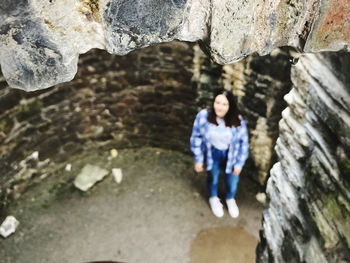 Woman standing on rock
