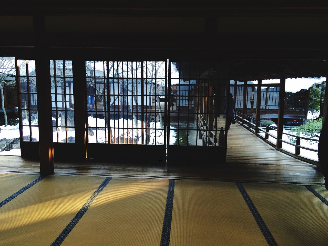 indoors, window, glass - material, architecture, built structure, chair, absence, transparent, empty, flooring, table, sunlight, interior, reflection, shadow, restaurant, day, ceiling, wood - material, modern