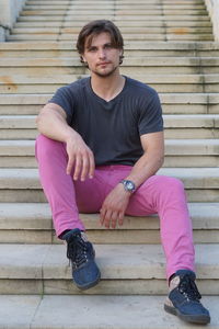 Portrait of man sitting on steps