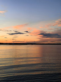 Scenic view of sea against romantic sky at sunset