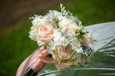 Close-up of hand holding bouquet