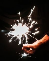Low angle view of firework display at night
