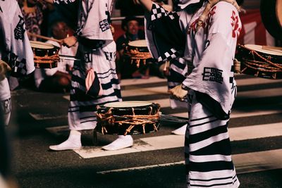 Low section of man sitting on bench