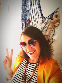 Portrait of young woman wearing sunglasses