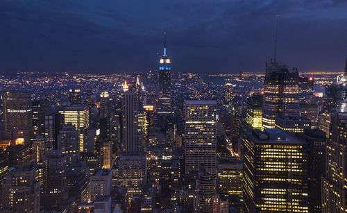 Illuminated buildings in city at night