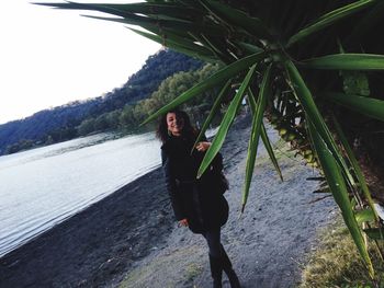 Woman with umbrella on tree