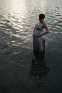 Woman standing in lake