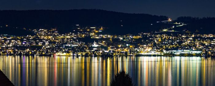 High angle view of illuminated buildings in city at night