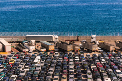 High angle view of buildings by sea