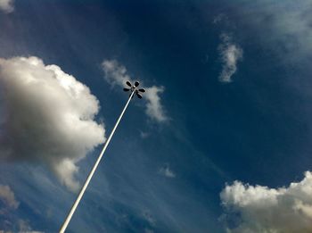 Low angle view of street light against cloudy sky