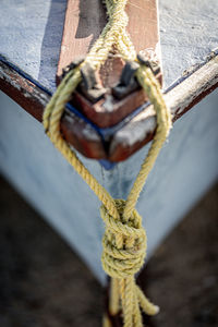 Close-up of rope tied on wood