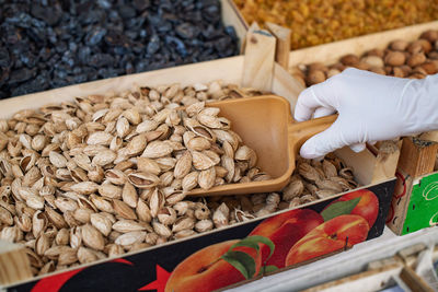 High angle view of hand in gloves  for sale at market stall